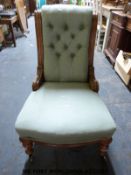 A 19th century upholstered nursing chair