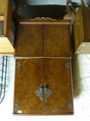 An Art Deco style walnut drinks cabinet raised on cabriole legs (W68 x D45 x H145cm)