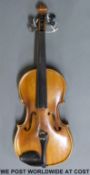 A cased 20th century continental violin, with 35cm two piece back,