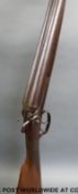 Unnamed 12 bore side by side hammer action shotgun with ornately engraved side locks and hammers,