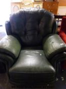 Dark green leather Chesterfield style armchair