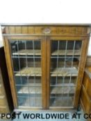 A glazed display cabinet (W91 x D30 x H128cm)