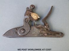 A 19thC flintlock lock with crown over GR cypher, 17cm long.