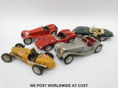Five Burago 1:18 scale diecast model cars
