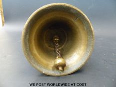 A WWII home guard/air raid warden style brass bell with paperwork giving history of it being ex