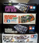 Four Tamiya model Le Mans car kits, Porsche 956, Sauber-Mercedes C9, Mazda 787B and Jaguar XJR-9LM,