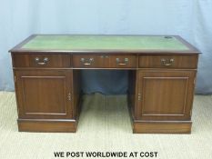 A leather inset twin pedestal desk (L161 x D76 x H78cm)
