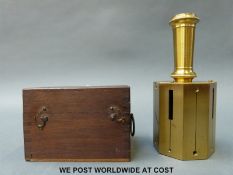 A cased surveyor's brass sighting scope