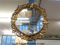 A gilt framed circular mirror,