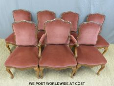 Seven (6+1) 19th/20th century upholstered mahogany dining chairs raised on cabriole legs.