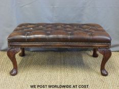 A leather Chesterfield footstool