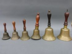 A collection of mainly 19th century hand bells of various sizes,