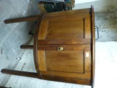 A 19th century mahogany barrel fronted corner cupboard on straight legs,