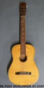 A six string German made 'Florida' half size acoustic guitar with nylon strings,