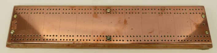 A large copper topped cribbage board (length 52cm)