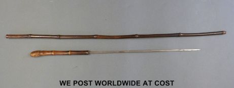 A bamboo sword stick with 36cm four faceted tapering steel blade,