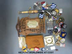 A quantity of various military badges and medals to include German, American etc, some reproduction,