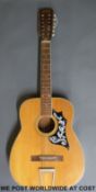 A 'Folk 12' 12 string acoustic guitar with ivorine trim and convex 50cm back