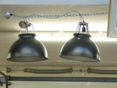 A pair of industrial hanging lights