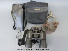 A pair of Simmons binoculars, gun holster, spurs, etc.