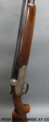 Italian 12 bore over and under shotgun with floral engraving to the locks,