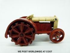 Dinky Toys diecast model Fordson N tractor with cream and red body and red wheels 22E