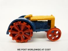 Dinky Toys diecast model Fordson N tractor with blue and yellow body and red wheels