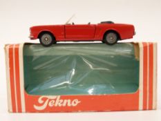 Tekno diecast model Ford Mustang with red body and black interior, 834, in original box.