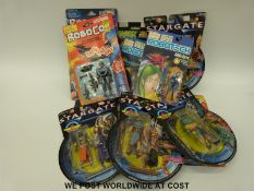 Thirteen Stargate, Robocop and Robotech action figures,