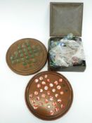 A large collection of vintage marbles and two wooden solitaire boards
