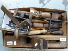 A quantity of vintage woodworking tools, including chisels, planes etc.