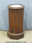 A Victorian circular marble topped pot cupboard,