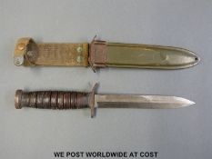 A WWII American US M3 fighting knife marked UTICA in M8 scabbard