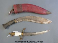 An ivorine handled knife with etched blade and eagle finial, probably Turkish,