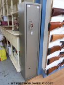 A metal gun cabinet/ safe with space for five guns.