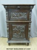 A Victorian carved oak cabinet (W183 x D57 x H129cm)