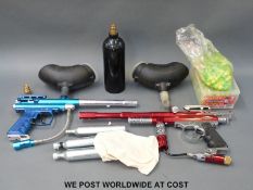 Two paintball guns, one Rebel Xtreme the other Spyder Victor together with various accessories,