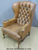 A leather Chesterfield wingback armchair
