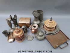 A quantity of pewter including plates, measures, tankards and early impressed mark spoons,