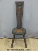 A carved oak prie dieu chair