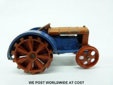 Dinky Toys diecast model Fordson N tractor with blue and red body and red wheels