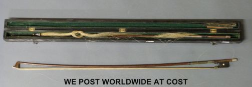 Two violin bows, one in a case,