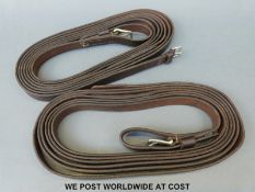 A boxed pair of leather driving reins made by Cooper of Bridlington