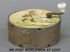 A late 19th century hand turned child's tin musical box playing two airs,