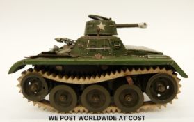 West German tin plate Gama tank with green body and white rubber tracks