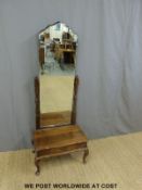 A mahogany cheval mirror with bevelled edge and drawer below,