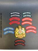 A complete set of titles of the Guards Household Brigade, including RSM's arm badge.