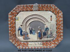A French relief moulded ceramic plaque