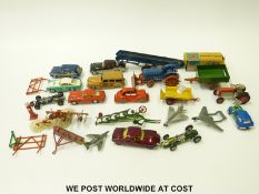 Twenty-four Corgi, Dinky and Britains diecast model vehicles including farm vehicles, aeroplanes,