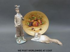 Lladro golfer figure and Nao cat,